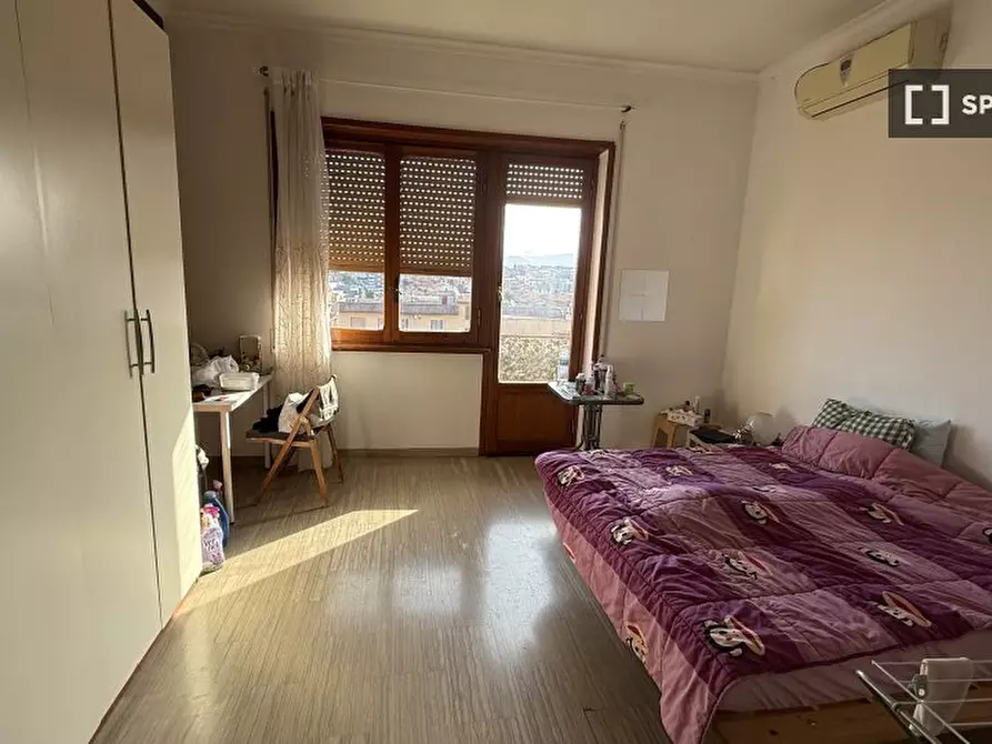 Immagine 1 di Camera condivisa in affitto  in Via Angelo Marabini a Roma